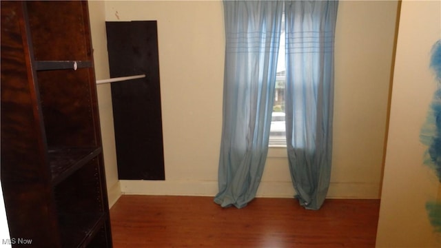 spare room featuring hardwood / wood-style floors