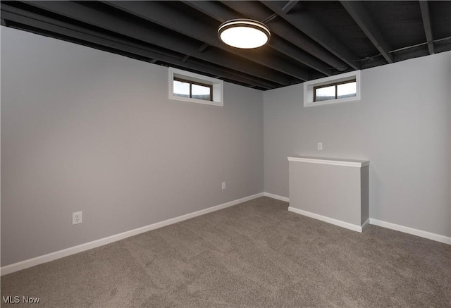 basement with carpet floors and a healthy amount of sunlight