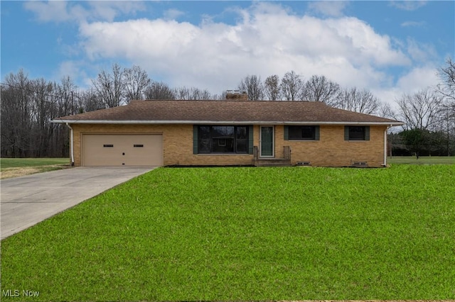 ranch-style home with a garage and a front lawn