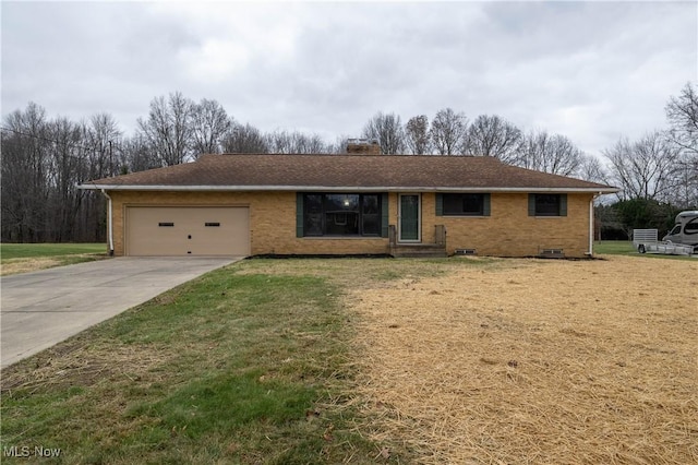 ranch-style house with a front yard and a garage