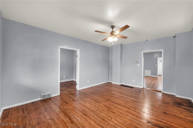 empty room with hardwood / wood-style flooring and ceiling fan