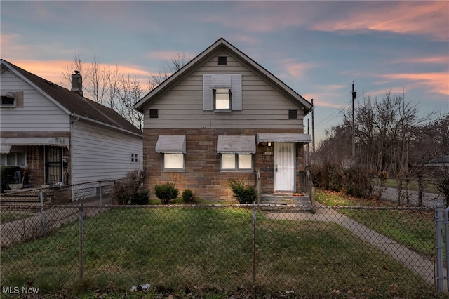 view of front of house with a yard