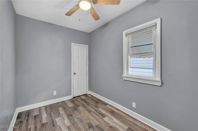 spare room featuring ceiling fan and light hardwood / wood-style flooring