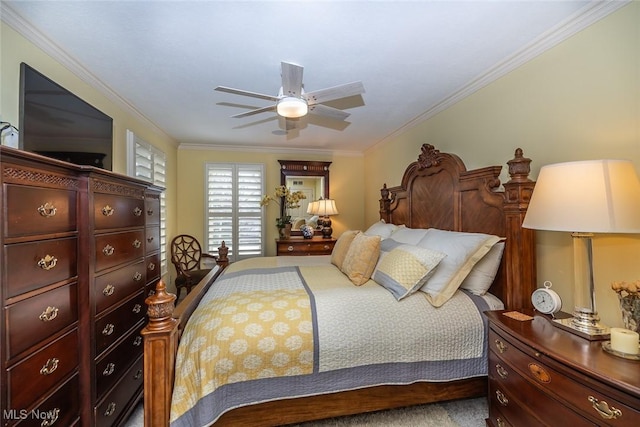 bedroom with ceiling fan and crown molding