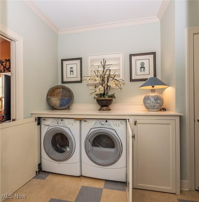 clothes washing area featuring ornamental molding and independent washer and dryer