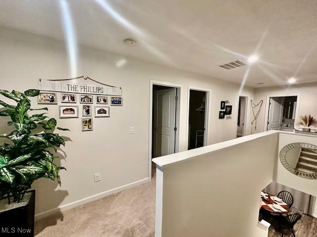 kitchen with light colored carpet