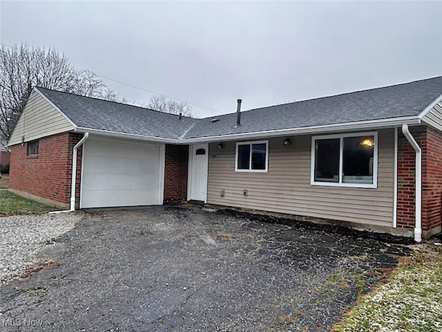 single story home with a garage