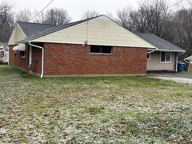 view of home's exterior featuring a lawn