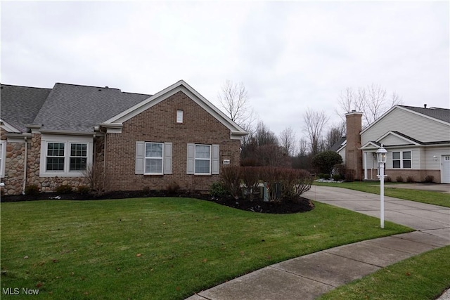 view of side of property featuring a yard