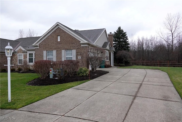 view of side of property featuring a yard