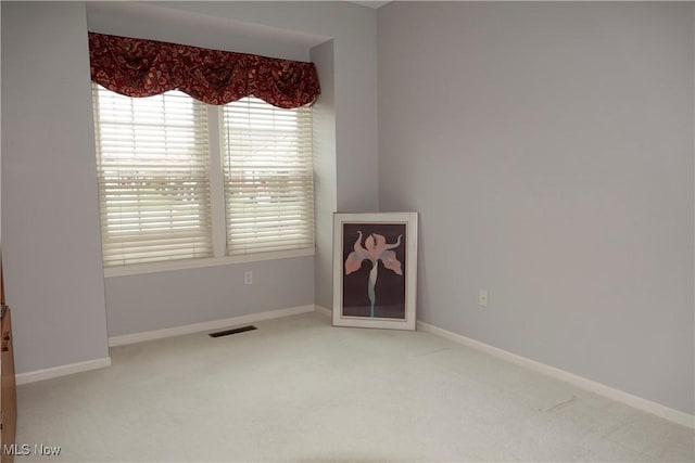 empty room featuring carpet flooring