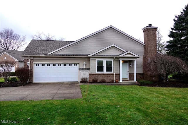 view of front of house with a front yard and a garage