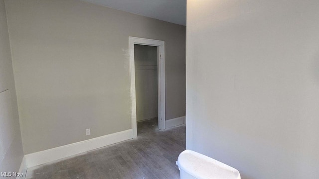 spare room featuring dark hardwood / wood-style floors