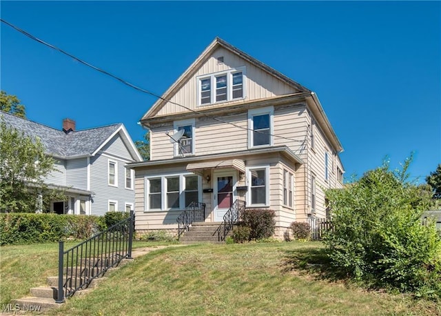 view of front of property featuring a front lawn