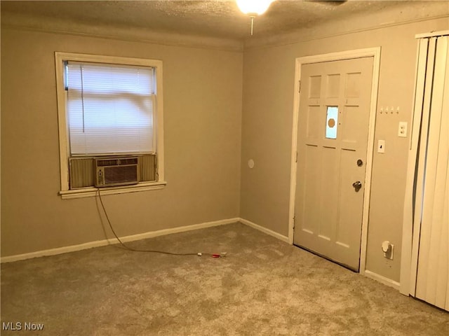 entryway with cooling unit and light carpet