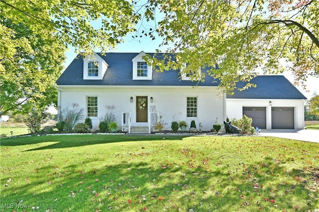 view of front facade with a garage and a front lawn