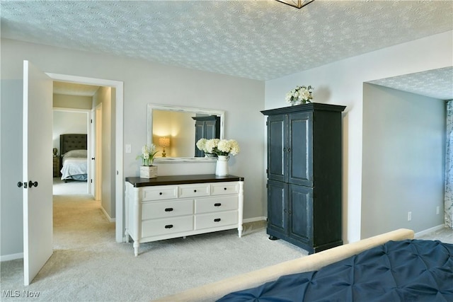 carpeted bedroom with a textured ceiling