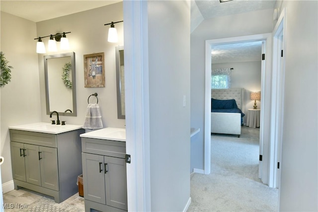 bathroom featuring vanity and a textured ceiling