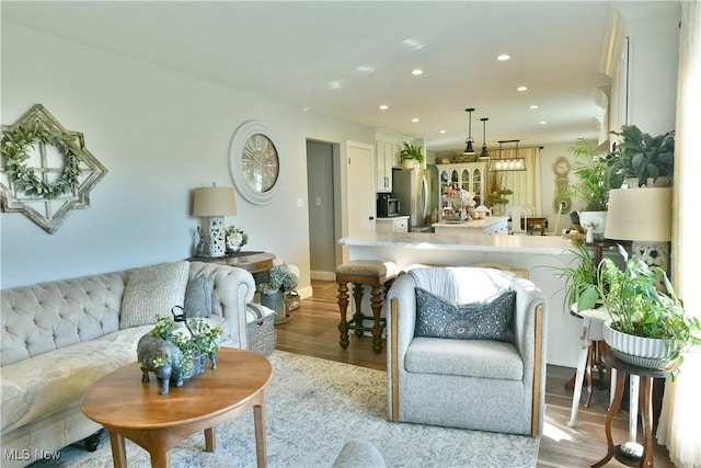 living room with light hardwood / wood-style flooring