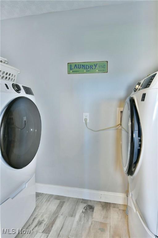 washroom with light hardwood / wood-style flooring