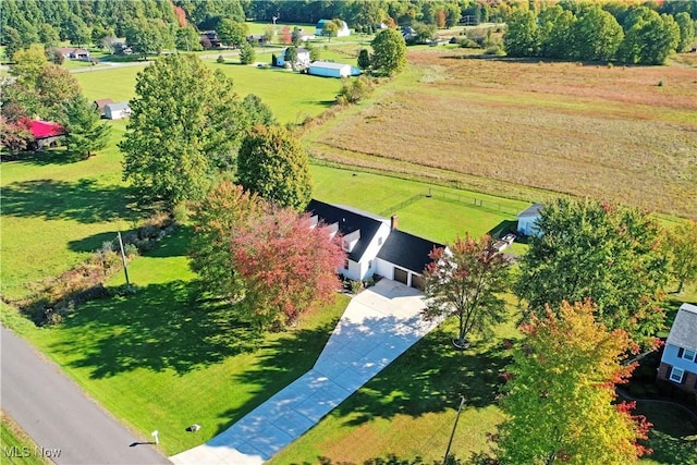 birds eye view of property with a rural view