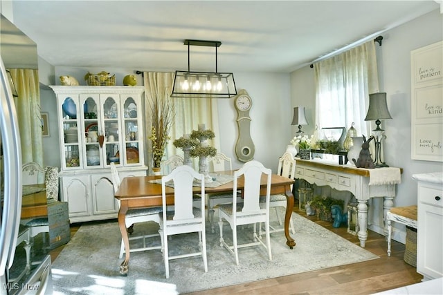 dining area with dark hardwood / wood-style floors