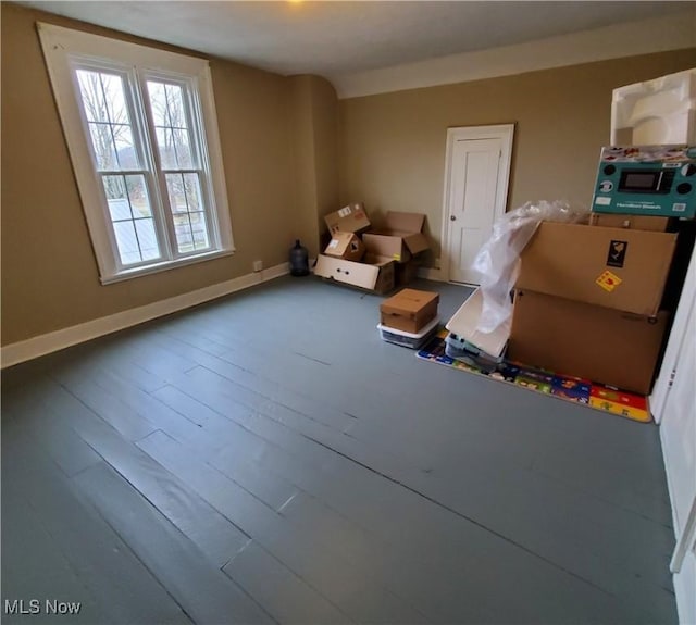 interior space featuring baseboards