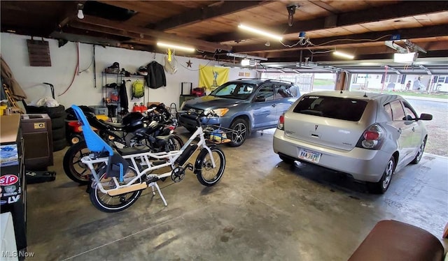 garage with wood ceiling and a garage door opener