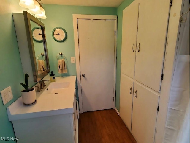 bathroom with wood-type flooring and vanity