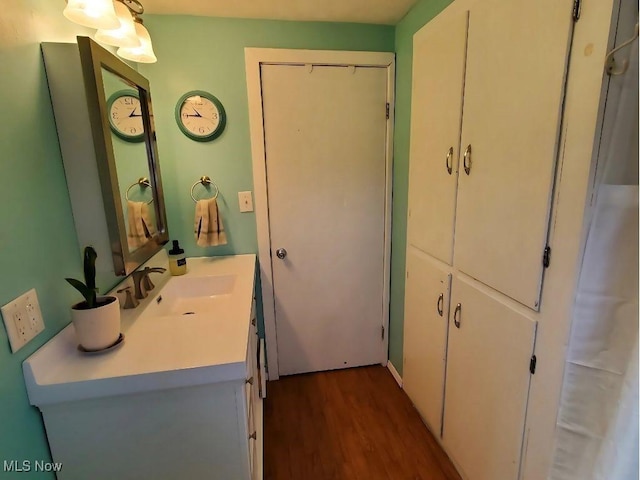 bathroom featuring vanity and wood finished floors