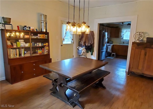 dining space featuring wood-type flooring