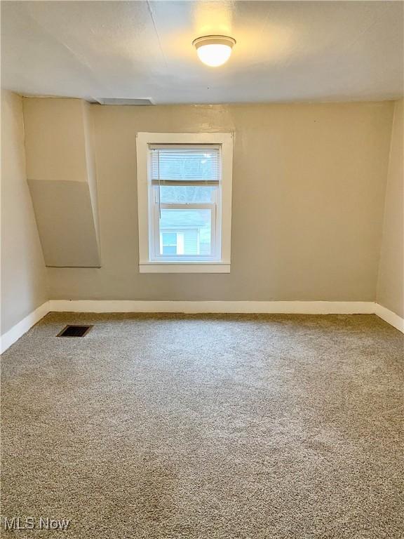 view of carpeted spare room