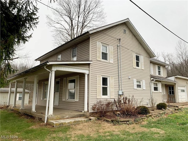 view of property exterior featuring a porch