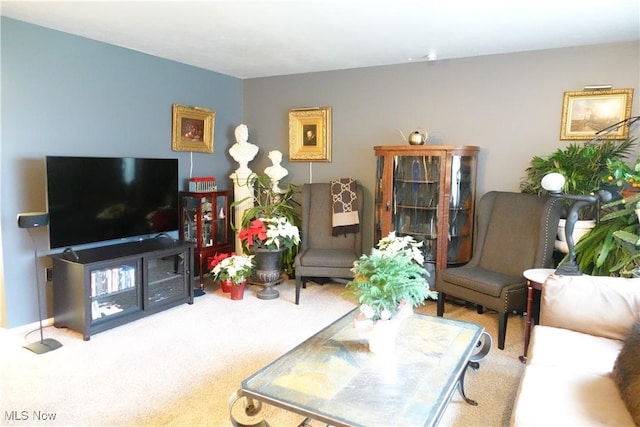 living room featuring light carpet