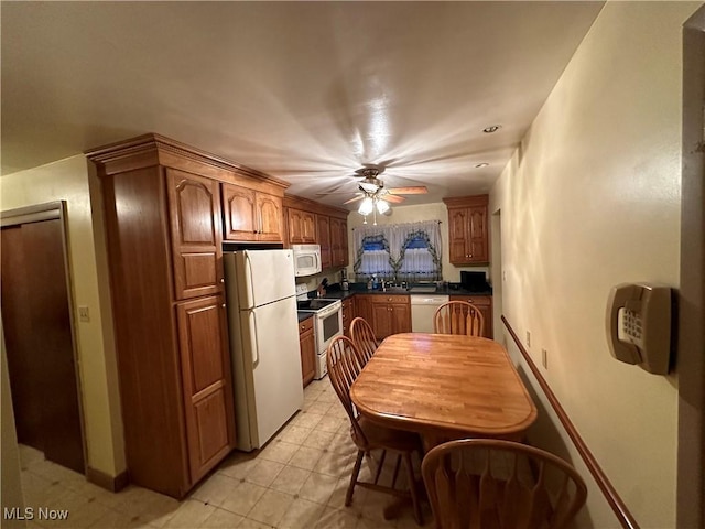 kitchen featuring ceiling fan and white appliances