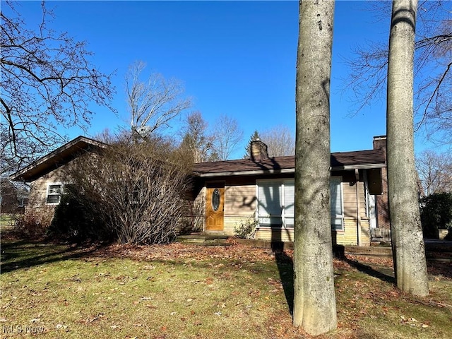 exterior space with a front lawn