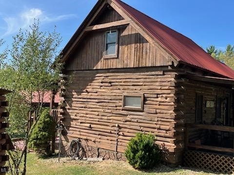 71352 Skyline Dr, Piedmont, OH 43983 - view of side of property featuring metal roof and log siding