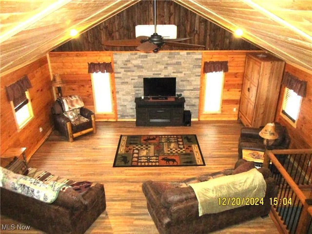 71352 Skyline Dr, Piedmont, OH 43983 - living area with wood walls, ceiling fan, wood finished floors, and vaulted ceiling