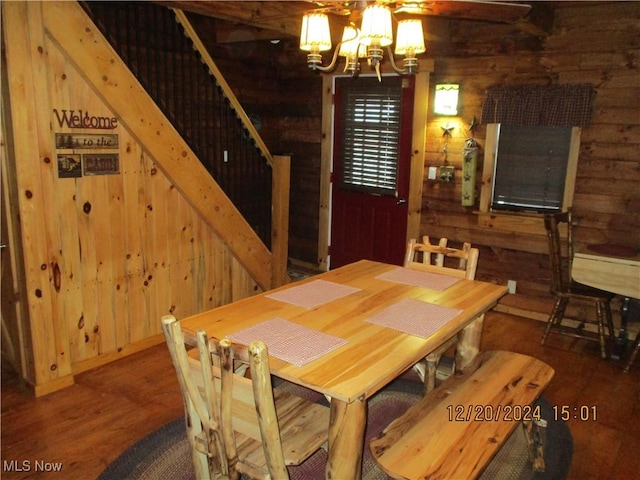 71352 Skyline Dr, Piedmont, OH 43983 - dining space with an inviting chandelier, wood finished floors, and wooden walls