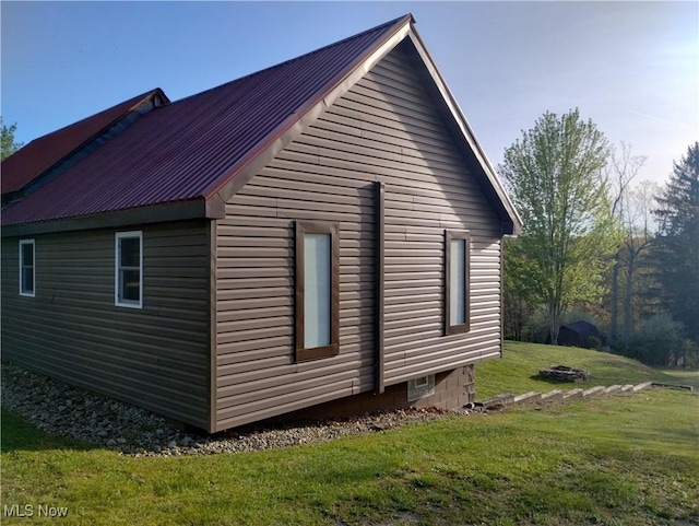 71352 Skyline Dr, Piedmont, OH 43983 - view of side of home featuring a lawn and metal roof