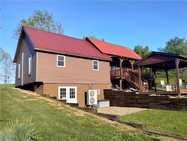 71352 Skyline Dr, Piedmont, OH 43983 - back of property with a lawn, ac unit, a gazebo, and metal roof