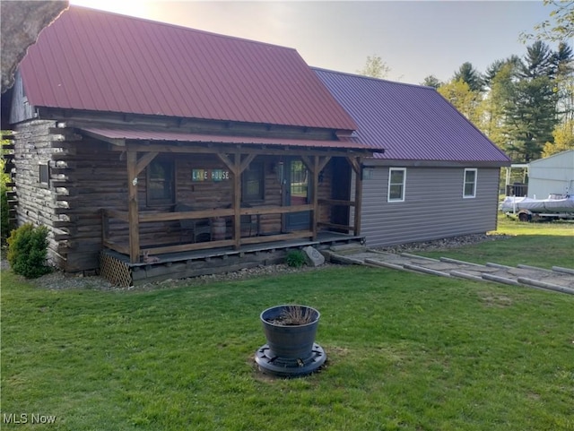 71352 Skyline Dr, Piedmont, OH 43983 - view of front of home featuring covered porch, metal roof, and a front lawn