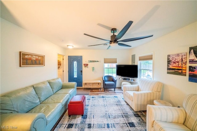 living room with hardwood / wood-style floors and ceiling fan