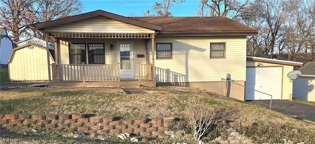 view of front facade featuring a porch and a garage