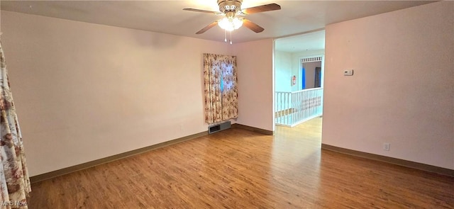 empty room featuring ceiling fan and light wood-type flooring