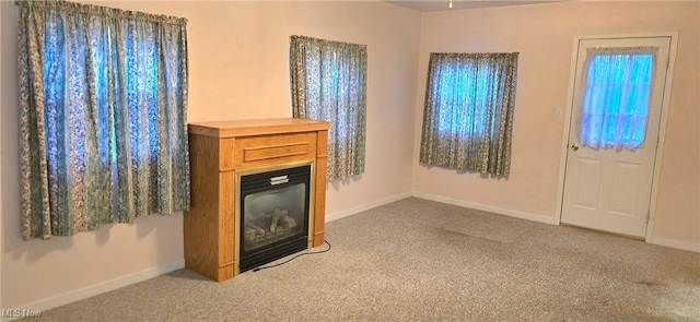 unfurnished living room with carpet flooring