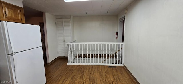 interior space with dark hardwood / wood-style flooring