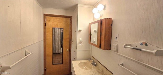 bathroom featuring vanity and crown molding