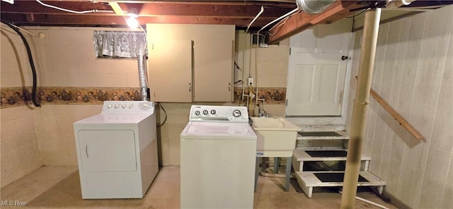 laundry area featuring washing machine and clothes dryer