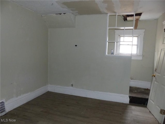 spare room with hardwood / wood-style flooring